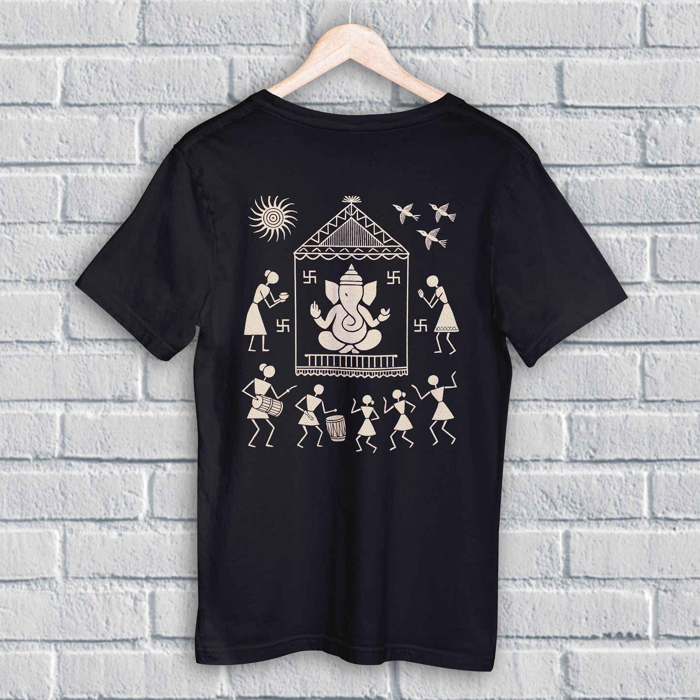 Ganpati T Shirt featuring Warli Ganesha design in beige on black cotton fabric, ideal for Ganesh Chaturthi and cultural celebrations.