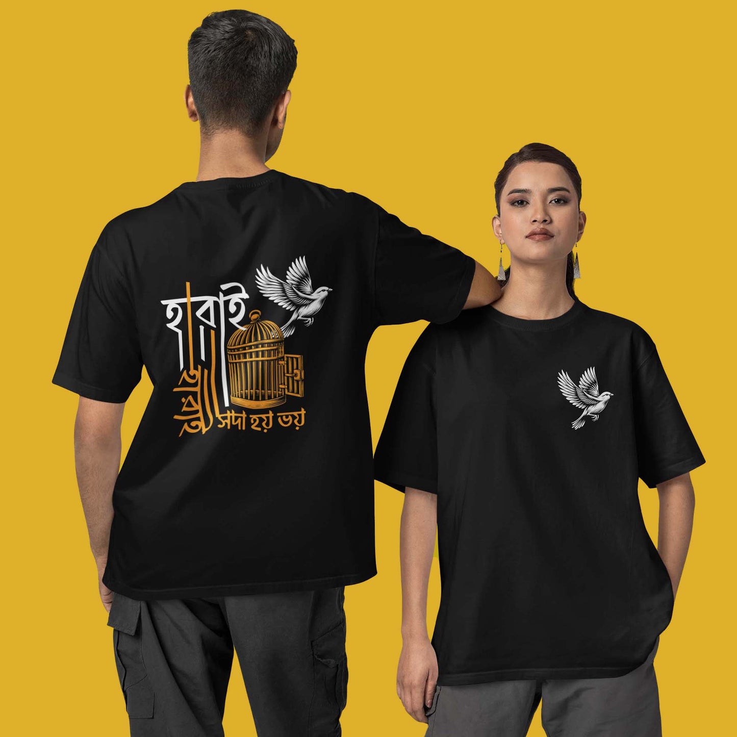 Model wearing Harai Harai oversized unisex Bengali T-shirt in black with a bird and cage cultural print, showcasing front and back views.