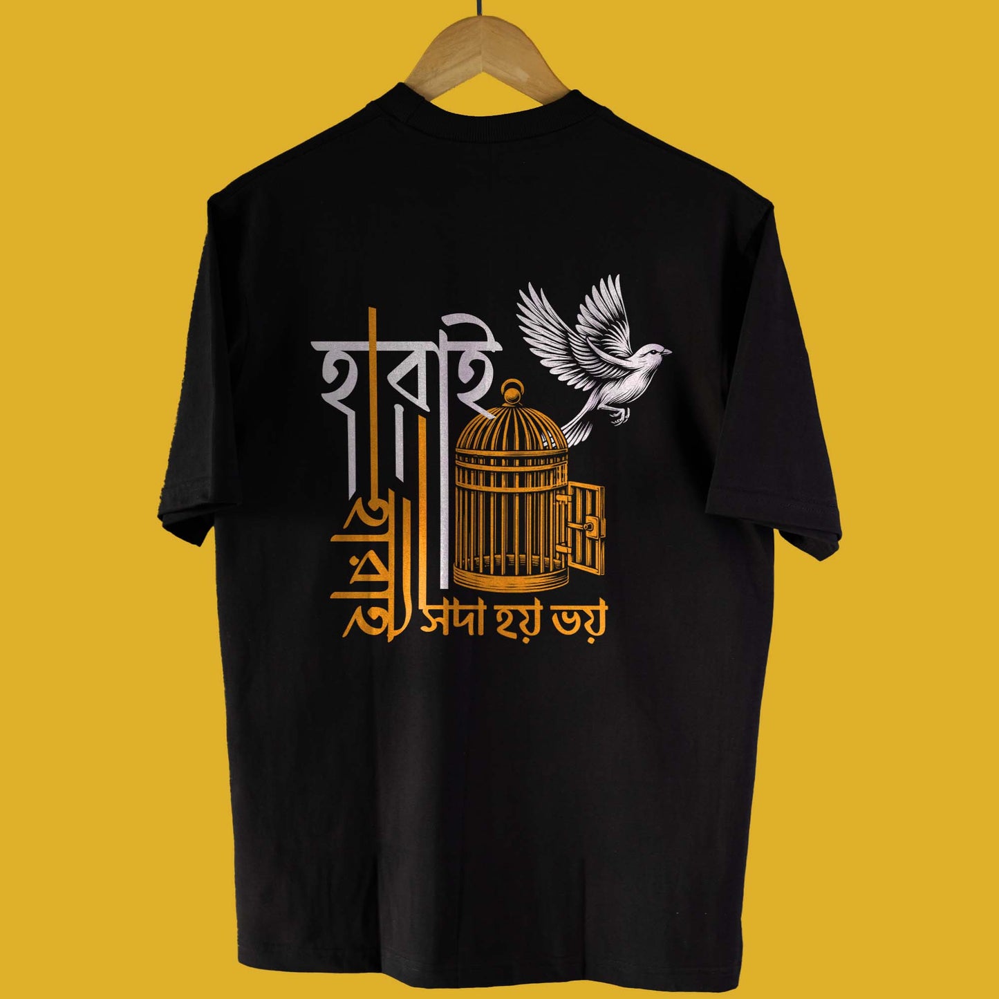 Back view of Harai Harai oversized unisex Bengali T-shirt in black, showcasing a detailed bird and cage cultural print.