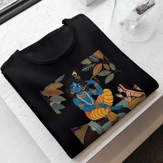 Krishna & Gopini graphic T-shirt featuring a Jamini Roy-inspired Indian folk art design on black cotton fabric. Cultural and stylish apparel for men and women.