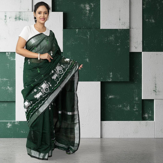 Kumorparar Gorur Gari Bengali cotton saree in heritage green with white gorur gari motifs, styled with a white blouse for traditional elegance.