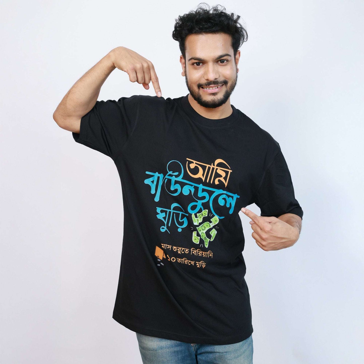 Model wearing black Ami Baundule Ghuri funny Bengali T-shirt with oversized drop shoulder fit, showcasing trendy Gen Z street style.