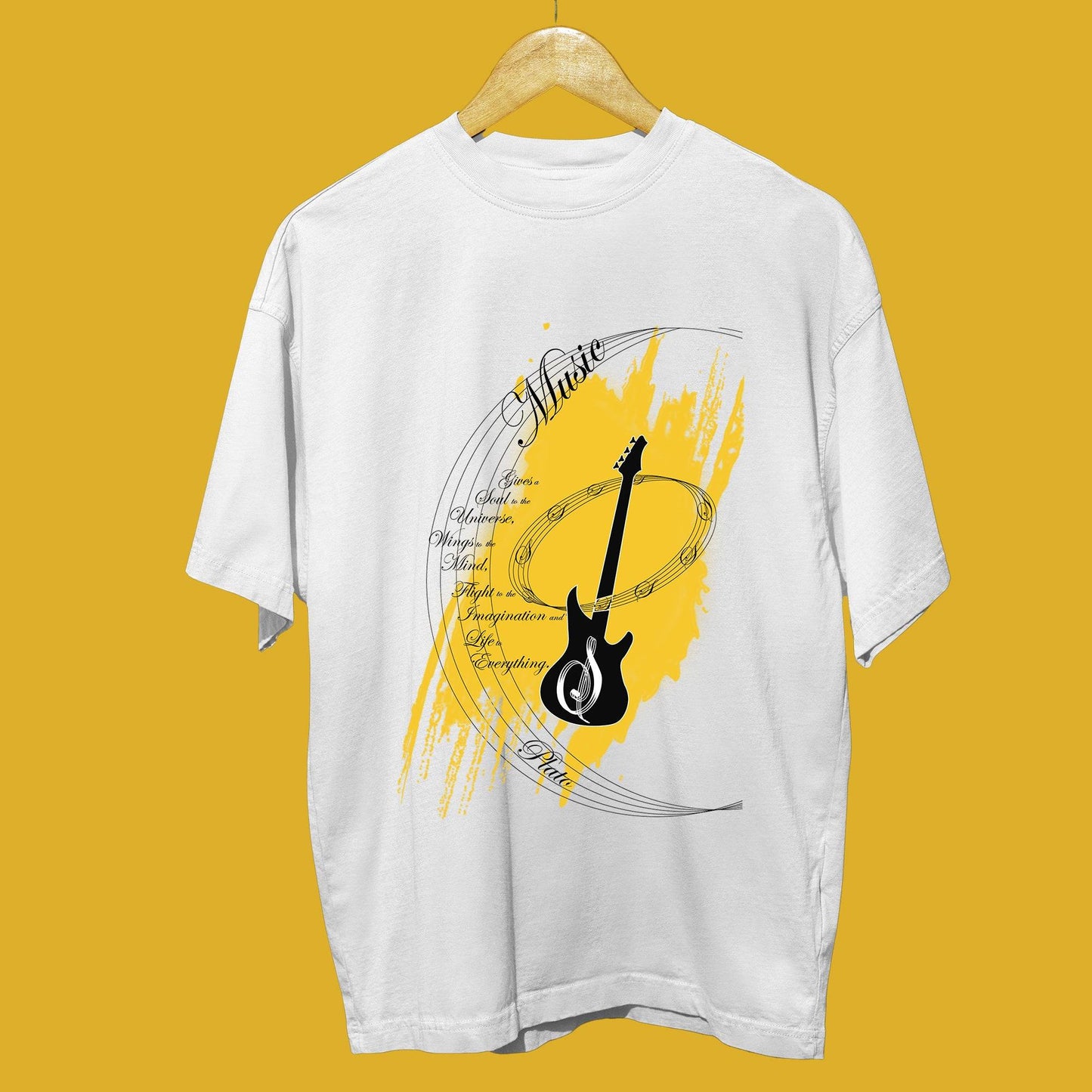 Music My Love oversized unisex t-shirt displayed on hanger, featuring a bold guitar graphic with yellow accents for music enthusiasts.