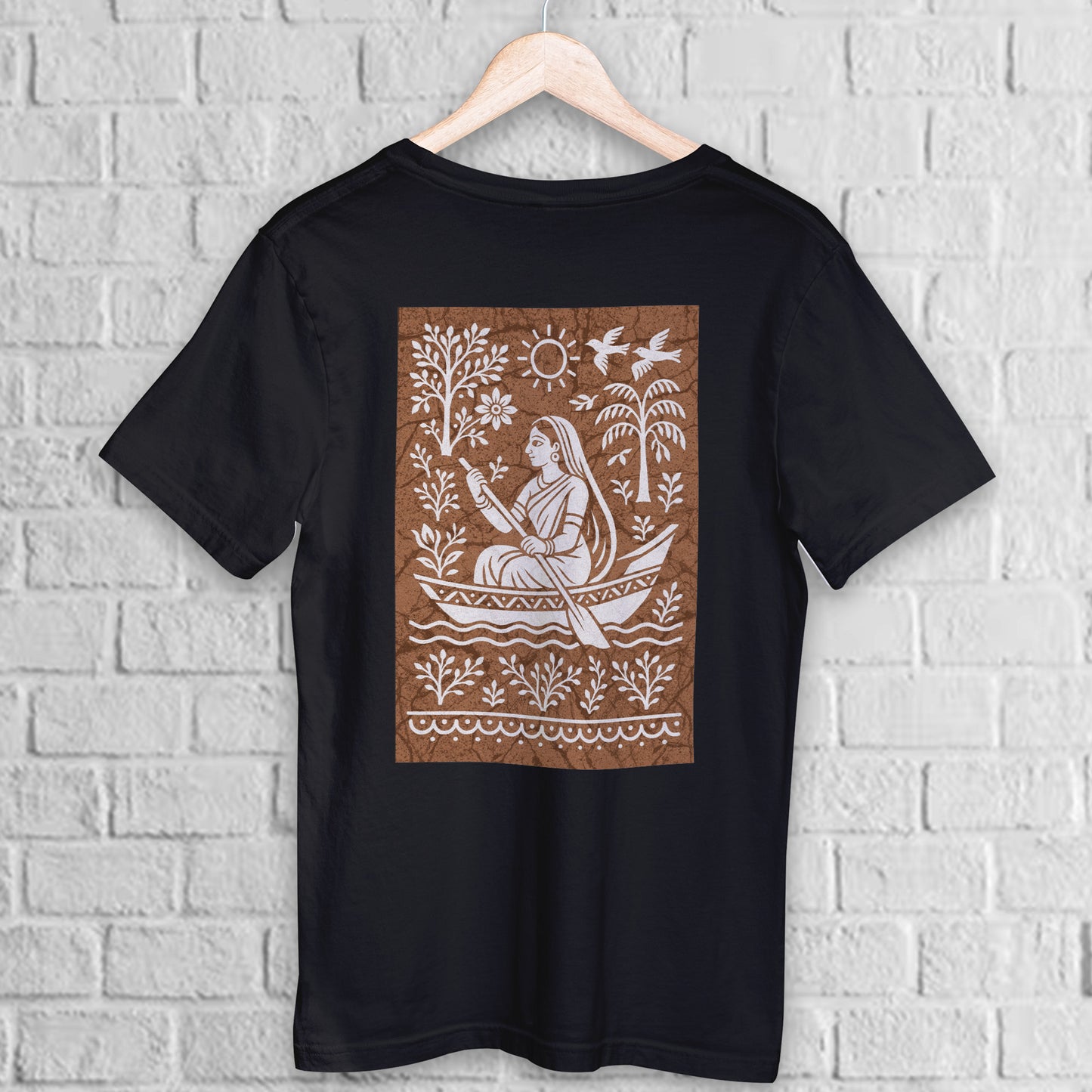 Bengali Boatwoman T-Shirt in batik folk art style on black premium cotton. Features a traditional boatwoman motif with nature elements on the back.