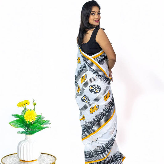 Kolkata Theme Cotton Saree in white with yellow taxi motifs and black cityscape design, ideal for festive and traditional Bengali wear.