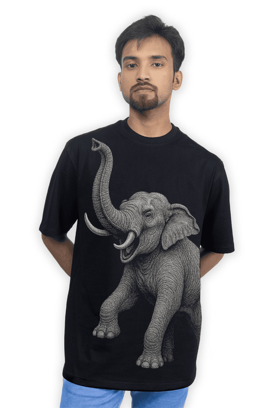 Model wearing the Indian Elephant Graphic T-Shirt with bold elephant artwork on the front. Relaxed unisex fit perfect for casual and artistic fashion.