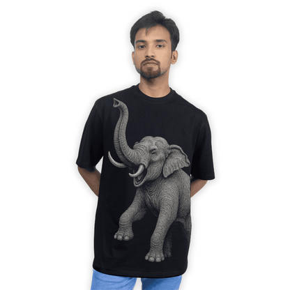 Model wearing the Indian Elephant Graphic T-Shirt with bold elephant artwork on the front. Relaxed unisex fit perfect for casual and artistic fashion.