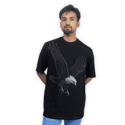 Model wearing Eagle Strike Oversized Animal T-Shirt with bold eagle design, showcasing unisex fit and casual wildlife-inspired style.