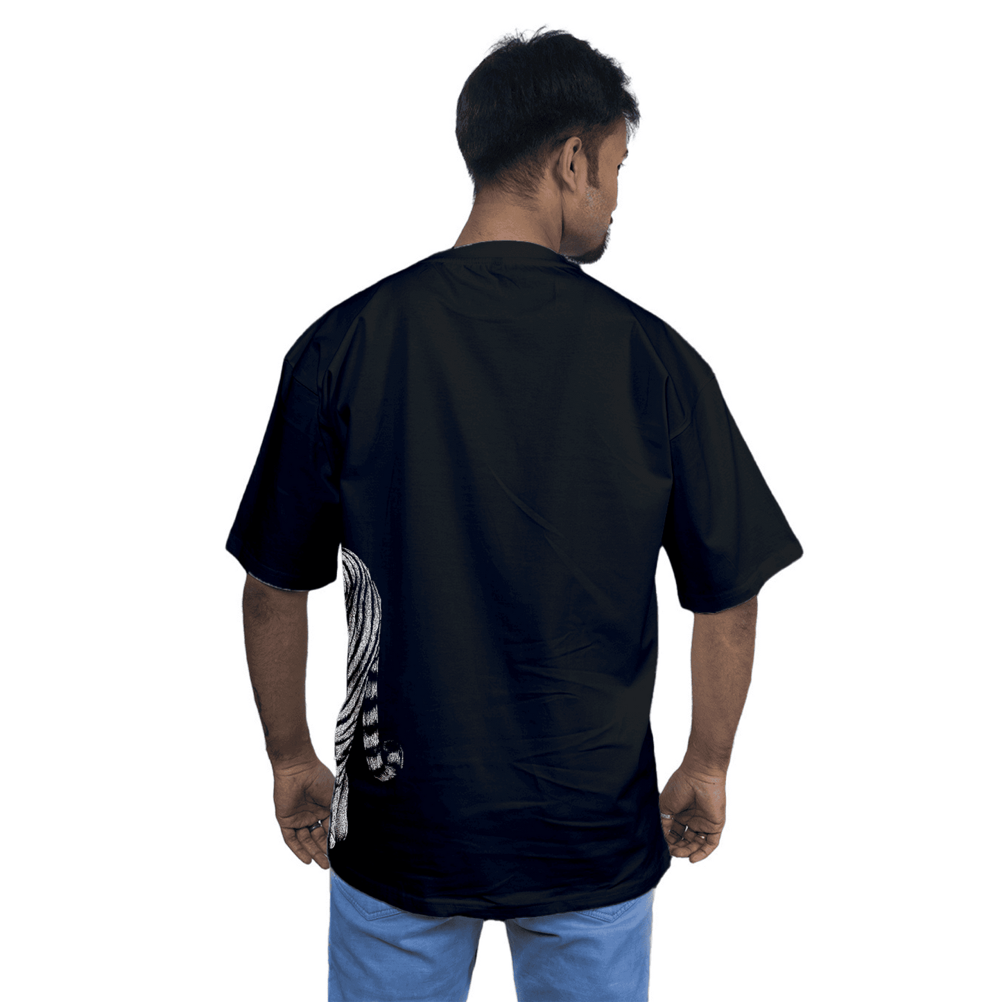 Rear view of model in Royal Bengal Tiger oversized unisex T-shirt, highlighting the extended tiger tail design on the back hem.
