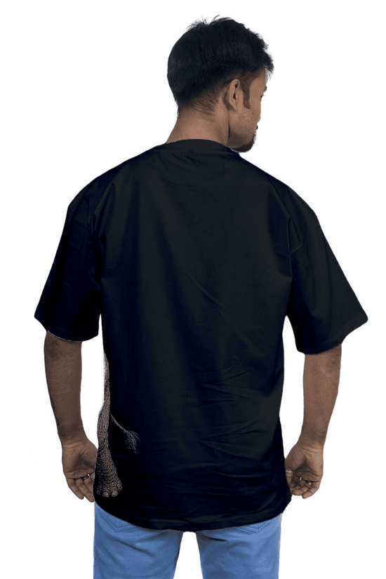 Rear view of model in Indian Elephant Graphic T-Shirt showing the oversized fit and partial elephant tail design on the back hem.