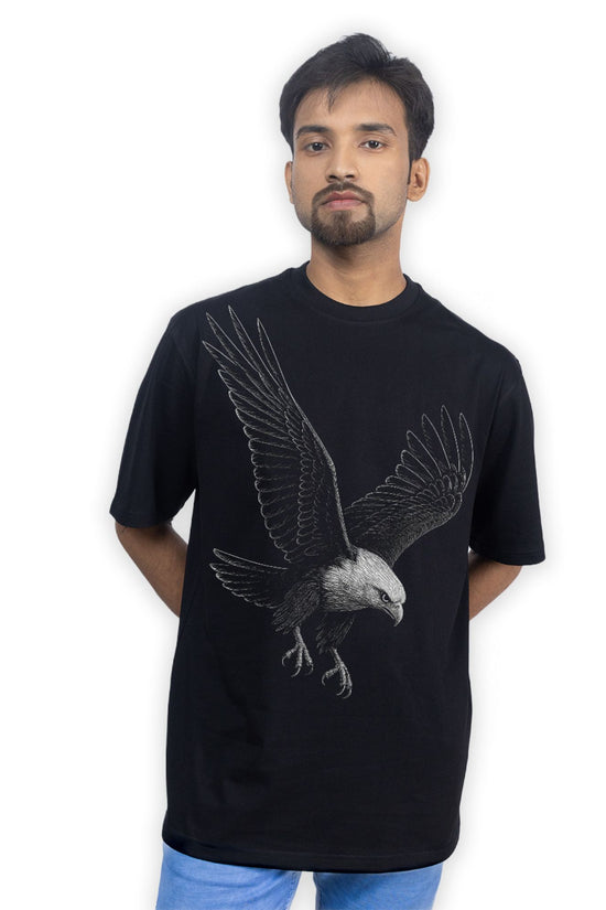 Model wearing Eagle Strike T-Shirt - Eagle tshirt | Oversized, unisex, streetwear styled casually with jeans, showcasing relaxed fit and bold eagle print.