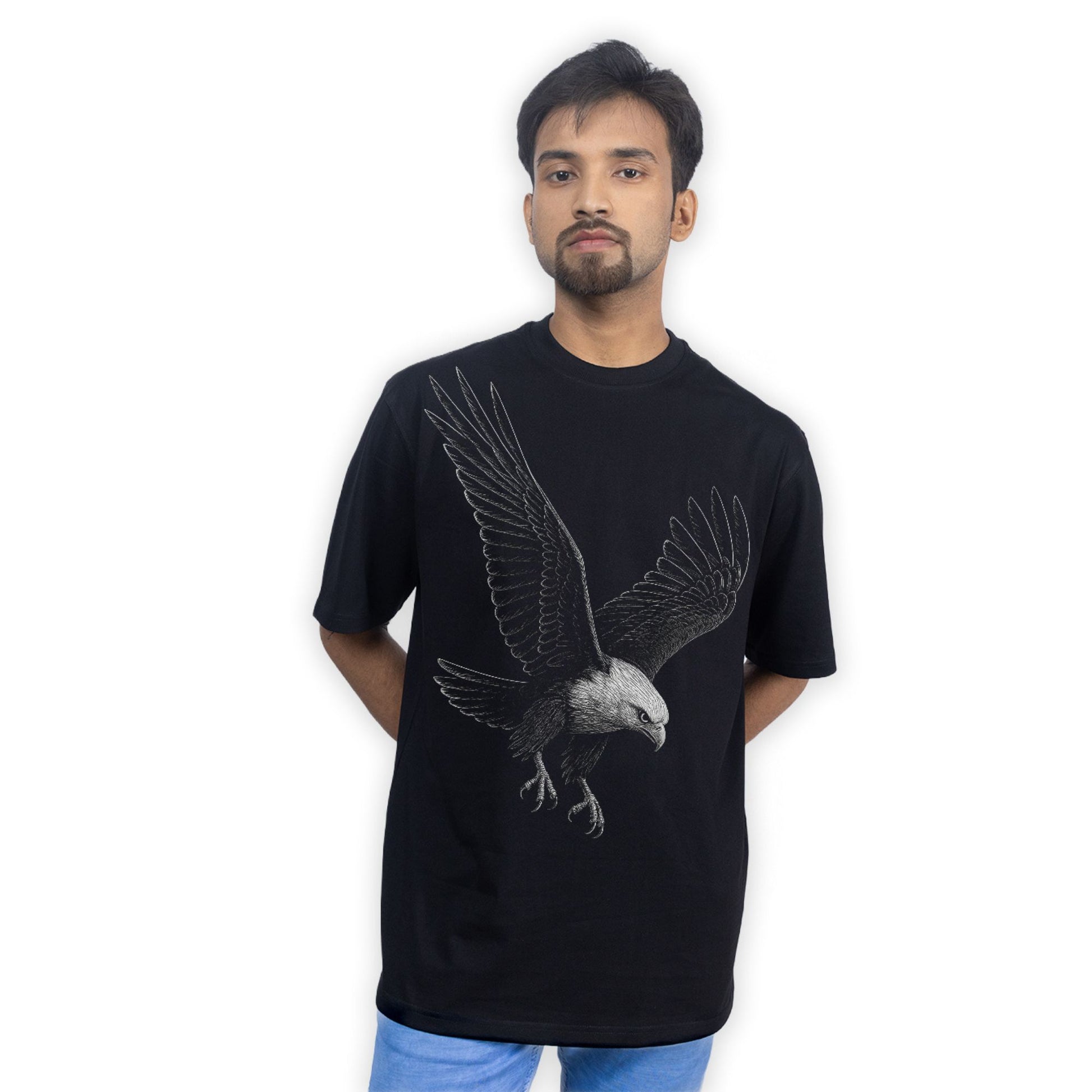 Model wearing Eagle Strike T-Shirt - Eagle tshirt | Oversized, unisex, streetwear styled casually with jeans, showcasing relaxed fit and bold eagle print.