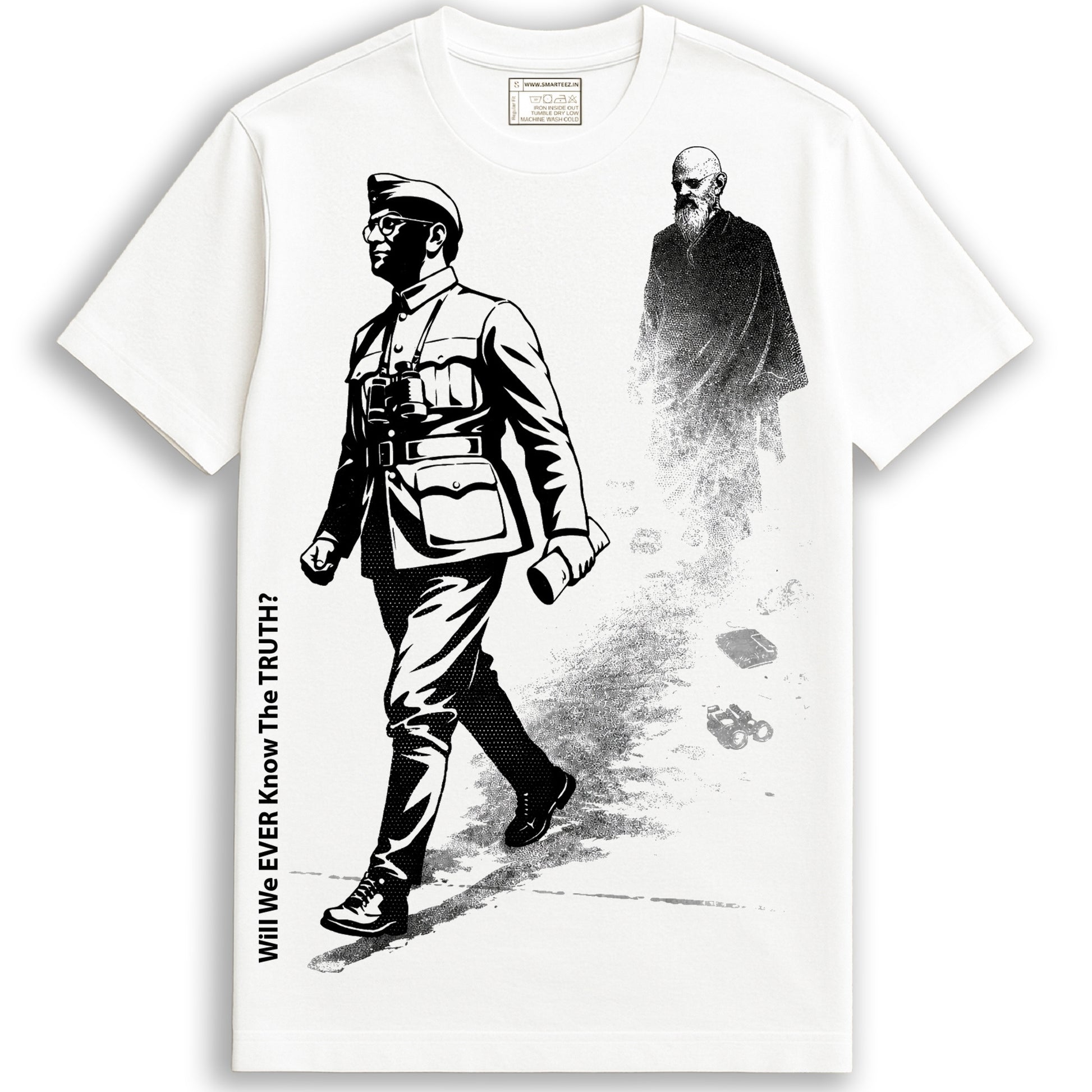 Will We Ever Know – Netaji T-shirt in white featuring bold black graphic of Subhas Chandra Bose and a fading monk, 100% cotton unisex fit.