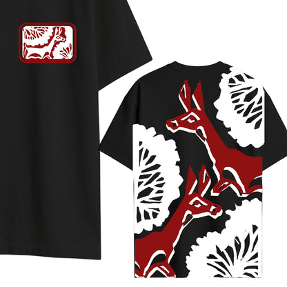 Close-up of Deer Sahaj Path T-Shirt highlighting intricate Bengali deer design on back and chest patch on black oversized cotton tee.