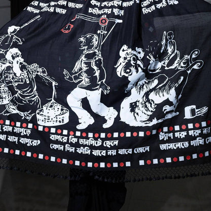 Close-up of Sukumar Ray illustrations and Bengali script on black saree
