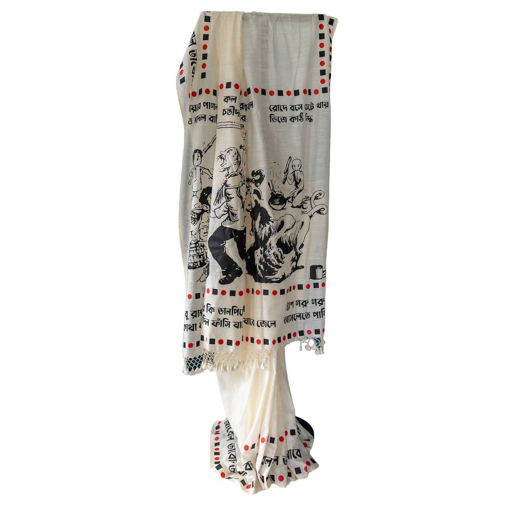Printed Khadi Cotton Saree with Sukumar Ray illustrations of the book 'Abol Tabol' - displayed on a stand