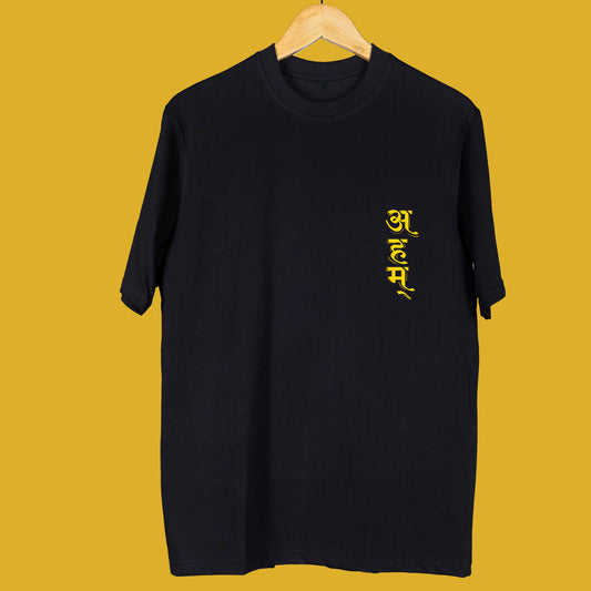 Black oversized unisex T-shirt 'Ahm' by Smarteez with yellow Sanskrit-inspired typography on the chest, celebrating individuality and culture.