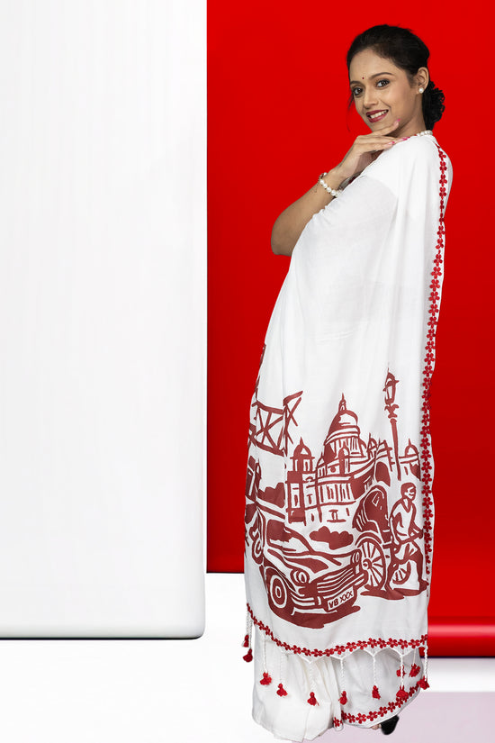 Amar Kolkata cotton saree with heritage print of tram, Howrah Bridge, and Victoria Memorial, ideal for festive and cultural wear.