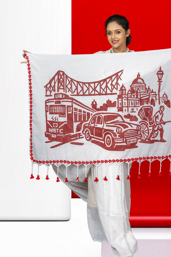 White cotton Kolkata Heritage Saree with bold red graphic of tram, taxi, and Howrah Bridge, celebrating the city's cultural icons.