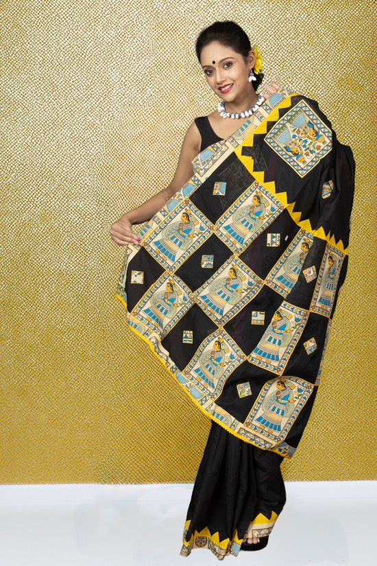 Heritage Appliqué Saree in black cotton with vibrant Bengali motifs and yellow borders, showcasing traditional craftsmanship for festive wear.