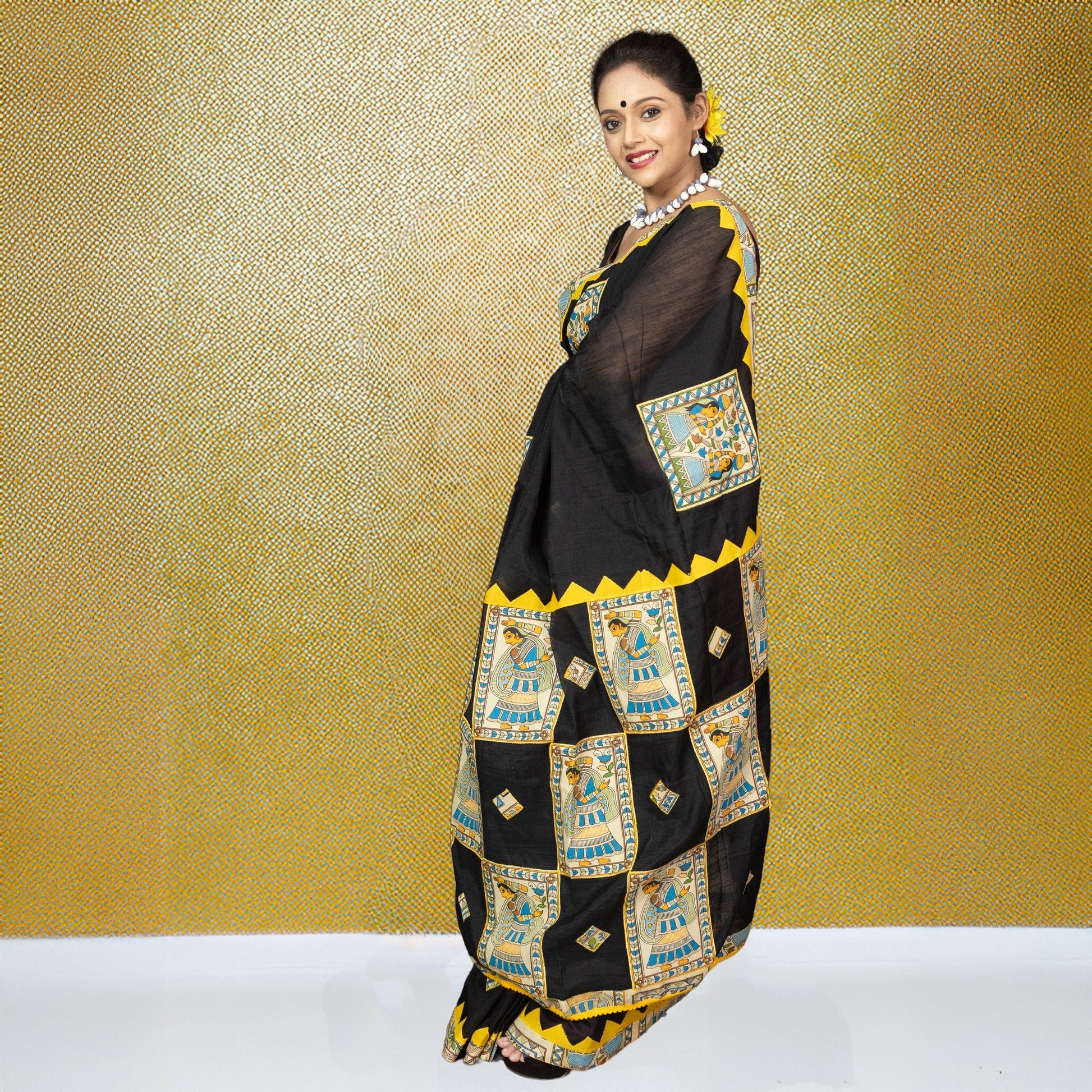 Elegant black Heritage Appliqué Saree with colorful Bengali folk appliqué work and yellow trim, perfect for traditional celebrations.