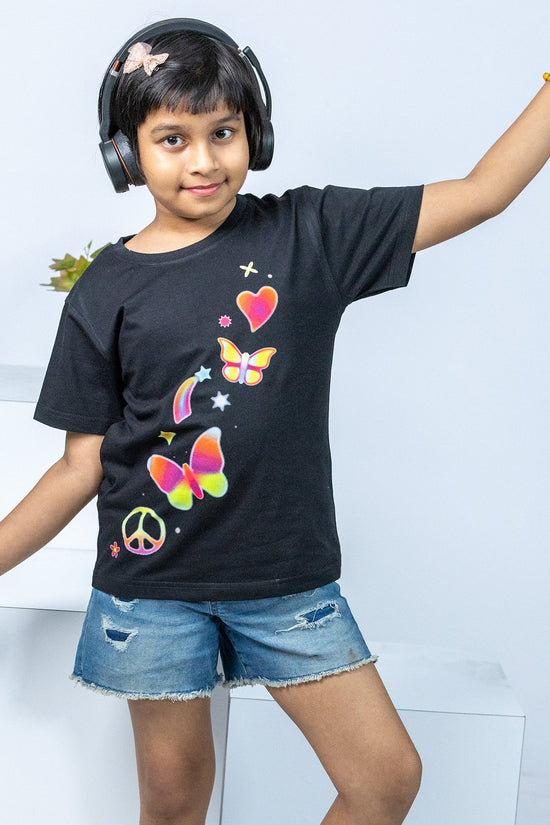 Butterfly printed T-shirt for girls in black, featuring colorful butterfly and heart graphics. Stylish and comfortable cotton tee for kids' fashion.