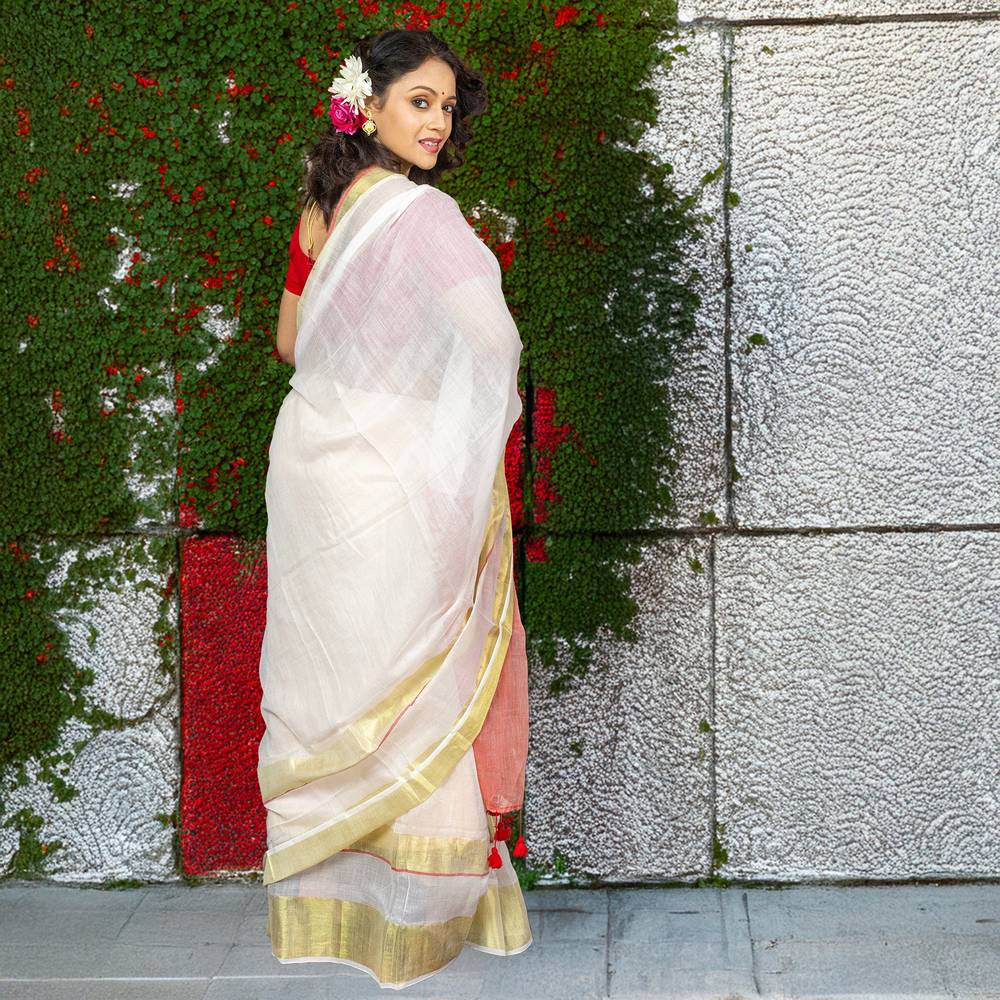 Back view of Chinmoyee Cotton Saree - Devi Durga, highlighting soft white cotton with gold border, ideal for traditional celebrations.