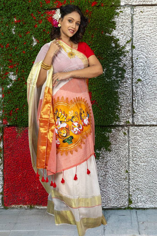 Heritage-inspired Chinmoyee Cotton Saree with Devi Durga artwork, red tassels, and golden accents, blending comfort with festive elegance.