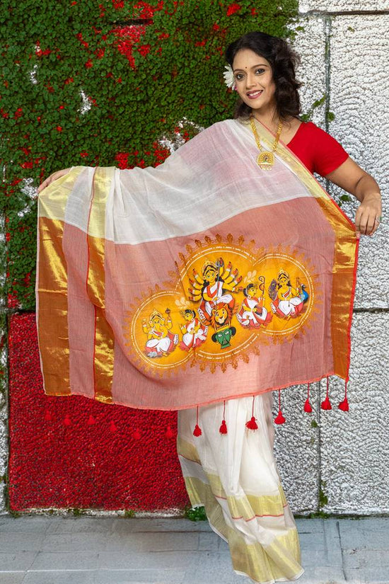 Chinmoyee Cotton Saree with Devi Durga print, showcasing traditional motifs and gold borders, perfect for Durga Puja and ethnic occasions.