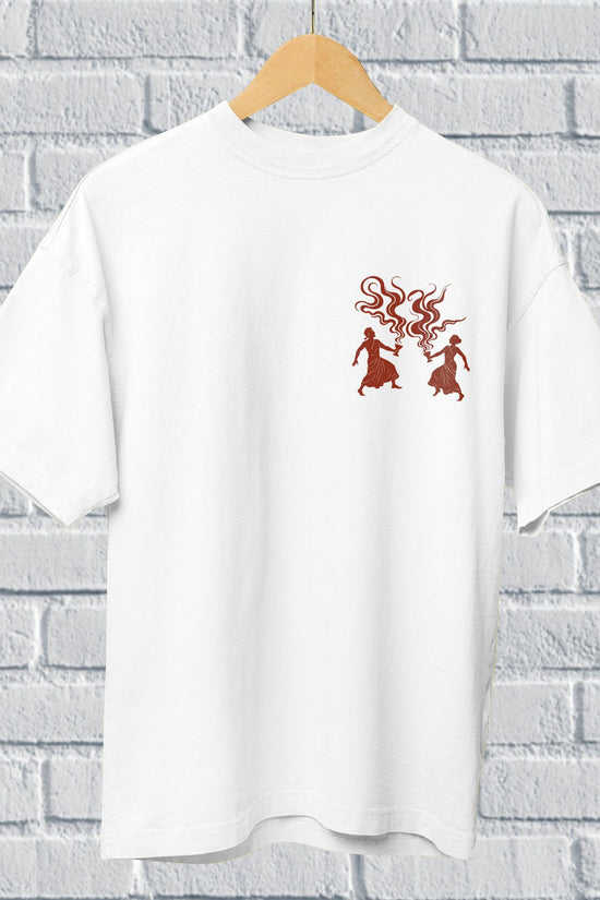 White oversized unisex Dhunuchi Dance Tee featuring minimal folk design of Durga Puja dancers in red. Ideal for celebrating Bengal's festive spirit.