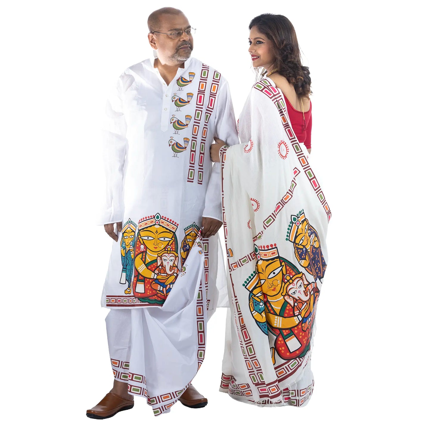 Couple wearing matching Jamini Roy style Durga Puja outfits — white cotton panjabi and khadi cotton saree with Maa Durga & her family folk art print