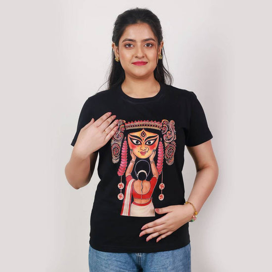 Woman wearing Durga Puja T-shirt with Boron tradition artwork, showcasing devotion and Bengali cultural heritage in festive apparel.