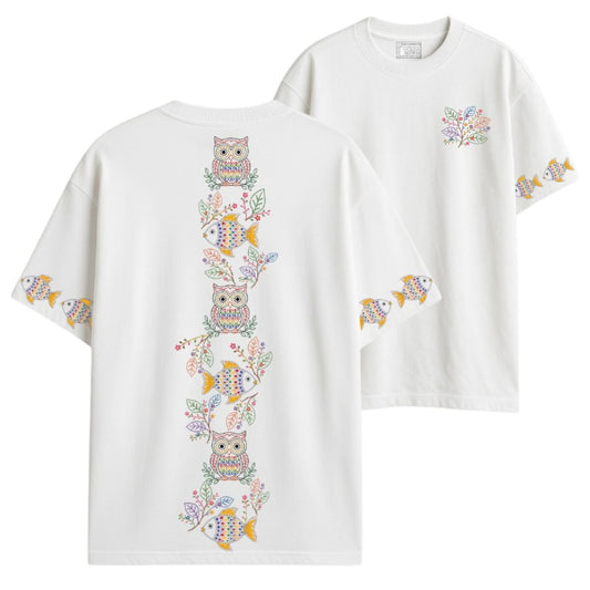 Close-up of Owl & Fish oversized T-shirt showing Kantha-inspired embroidery-style owl, fish, and floral branch print detail on white cotton