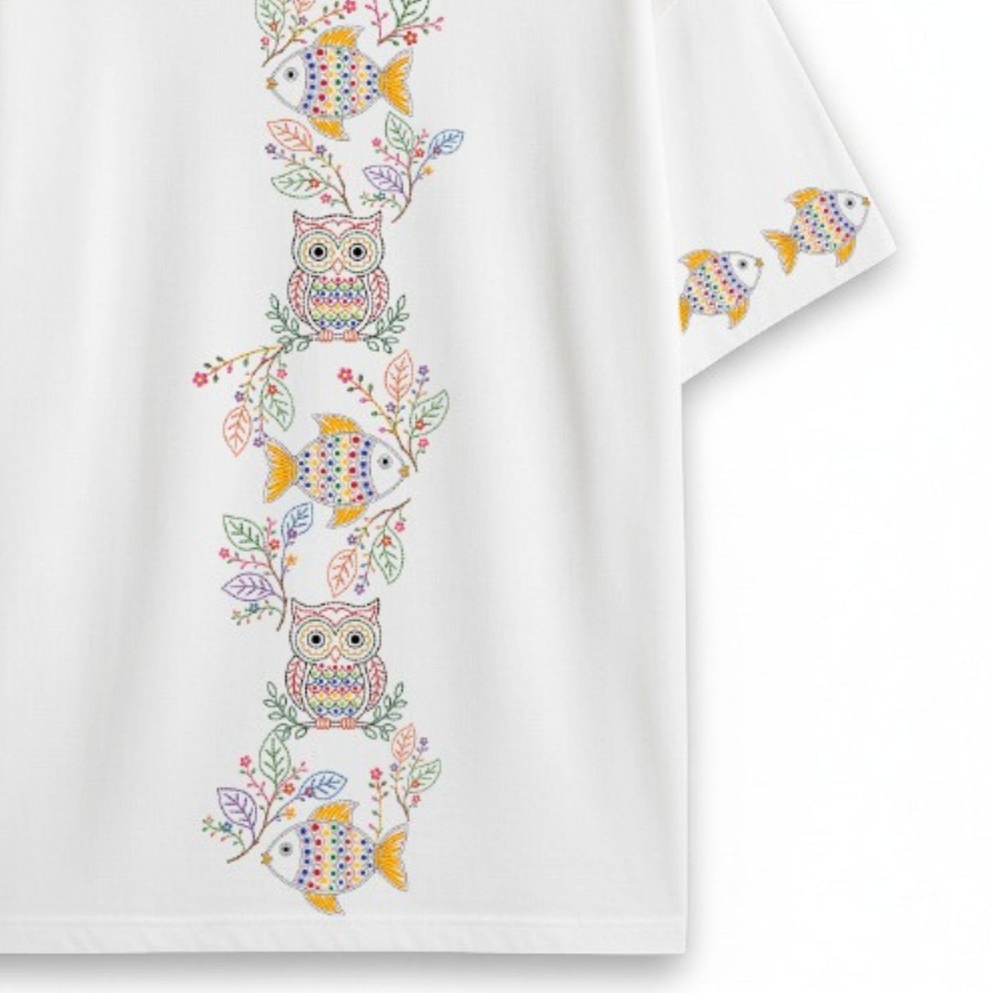 Back view flat lay of Owl & Fish oversized T-shirt showing vertical Kantha-inspired embroidery-style column of owls, fish, and floral branches