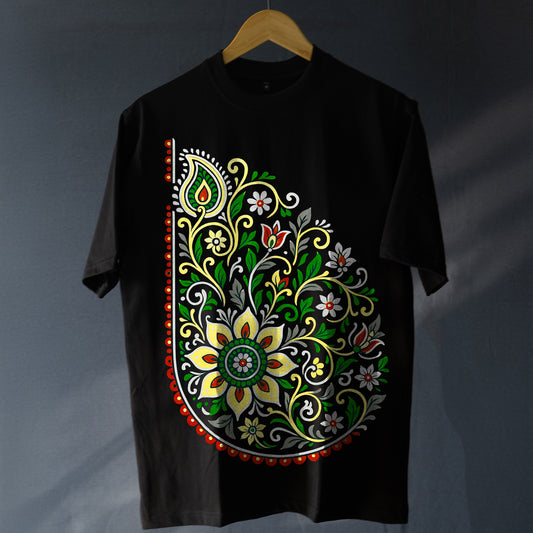 Unisex Folk Art T-Shirt - Oversized Style | 100% Cotton featuring vibrant floral paisley design in red, green, and yellow on black fabric. Ideal for modern boho fashion lovers seeking comfort and tradition.