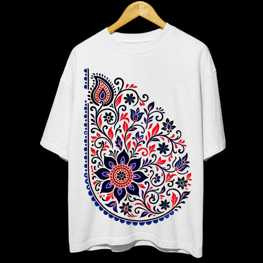 Unisex Folk Art T-Shirt in oversized fit featuring vibrant floral paisley design in red, blue, and black on white 100% cotton fabric. Ideal for casual wear.