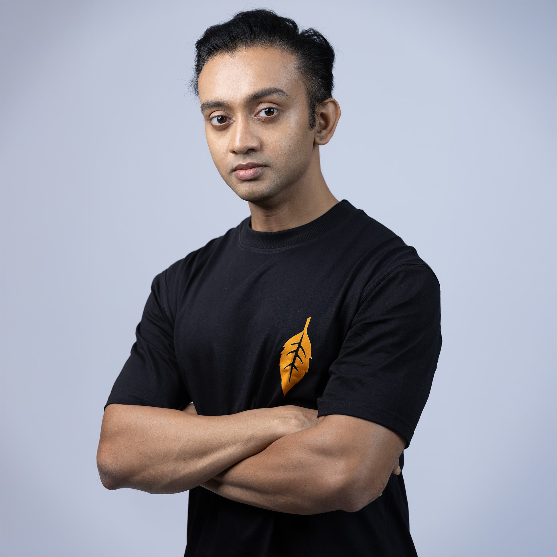 Front view of 'Ami Dhowa Tulsi Pata' oversized Bengali graphic T-shirt featuring a minimalistic leaf design. A must-have for casual streetwear lovers.