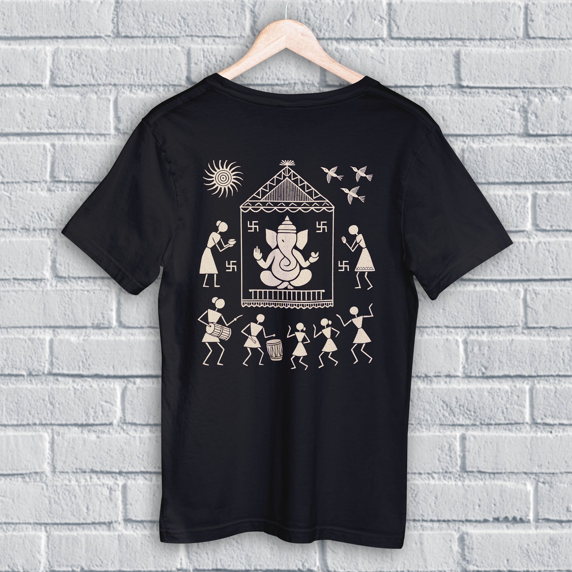 Ganpati T Shirt featuring Warli Ganesha design in beige on black cotton fabric, ideal for Ganesh Chaturthi and cultural celebrations.