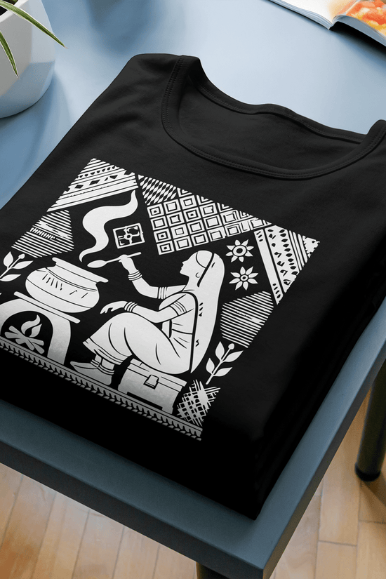 Graphic T-Shirt featuring reimagined Tagore art of a homemaker in traditional style. Black cotton tee with intricate white illustration, blending heritage with modern fashion.