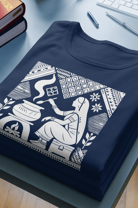 Graphic T-Shirt featuring reimagined Tagore art of a homemaker in traditional attire, printed on navy blue cotton fabric. A blend of heritage and modern fashion.