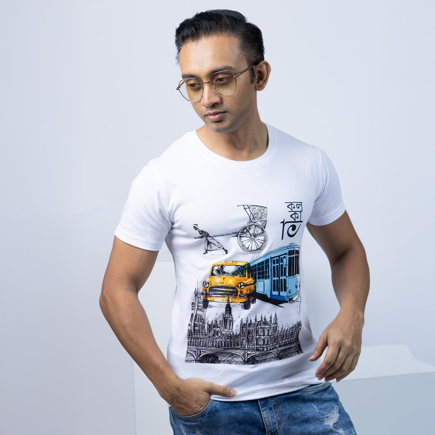 Kolkata T-Shirt - Iconic Transport Graphic in white cotton with yellow taxi, tram, and rickshaw print. Regular fit tee for men and women.