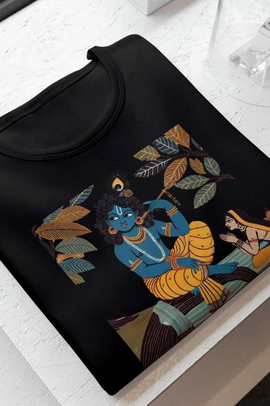 Krishna & Gopini graphic T-shirt featuring a Jamini Roy-inspired Indian folk art design on black cotton fabric. Cultural and stylish apparel for men and women.