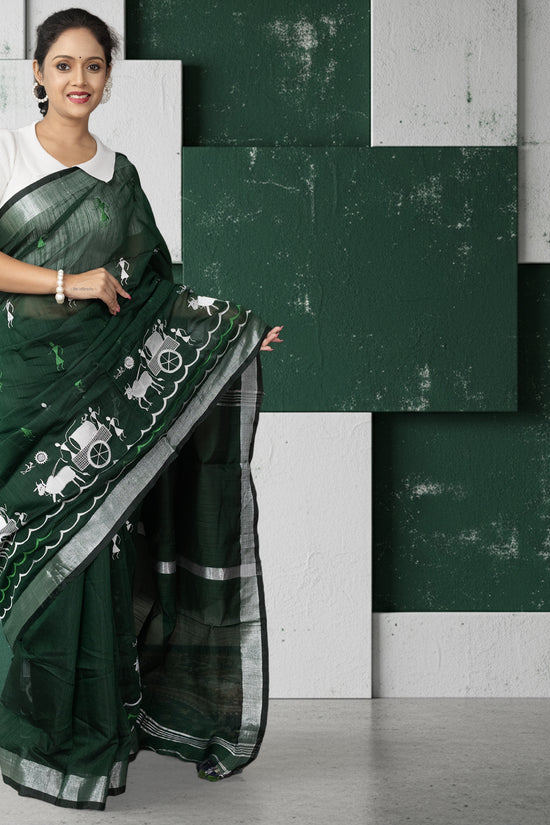 Kumorparar Gorur Gari Bengali cotton saree in heritage green with white gorur gari motifs, styled with a white blouse for traditional elegance.