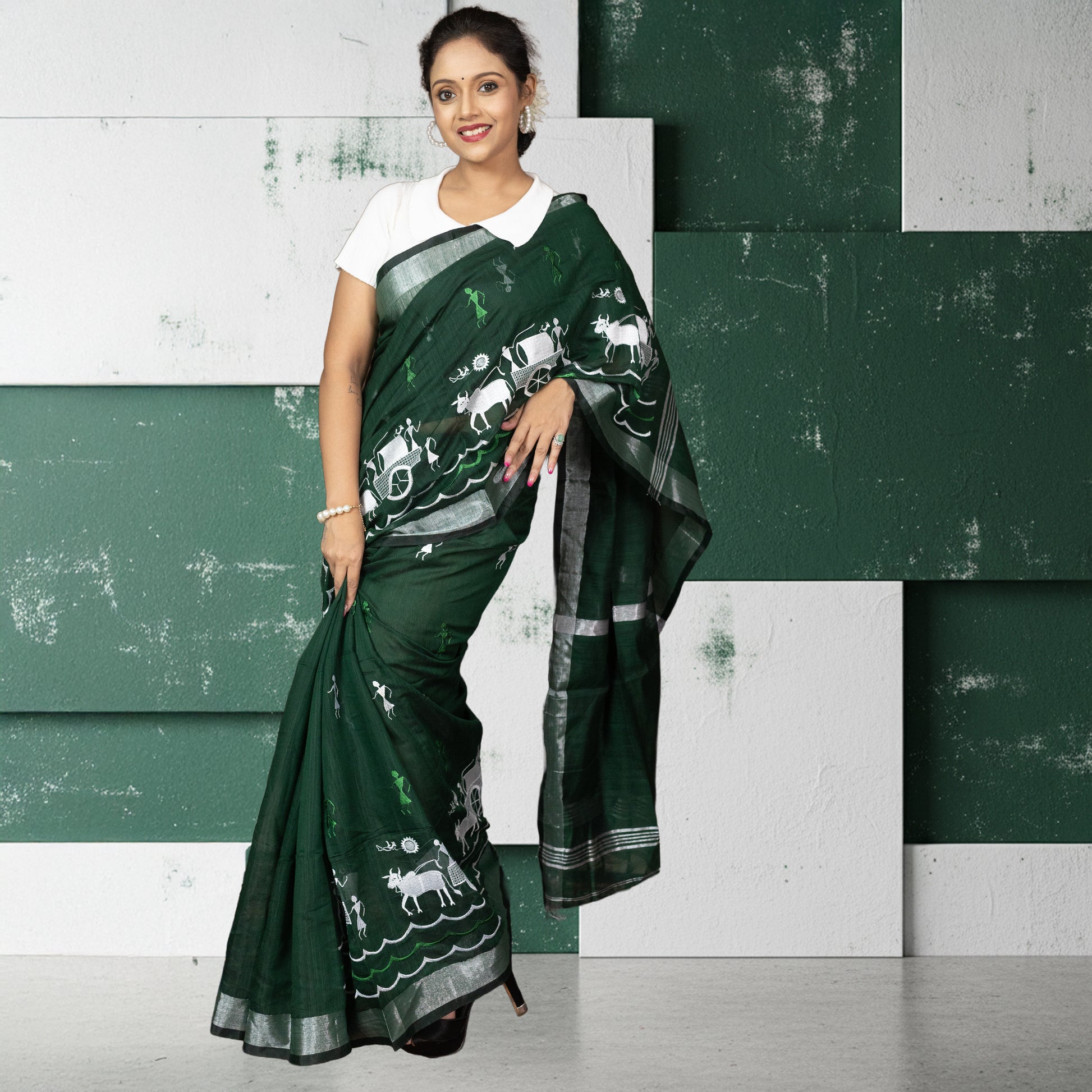 Model wearing heritage green Kumorparar Gorur Gari saree with white gorur gari patterns, blending Bengali tradition with modern comfort.