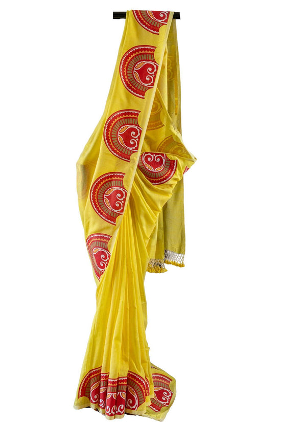 Sringer yellow khadi cotton saree with red circular Patachitra prints, perfect for traditional and festive occasions.
