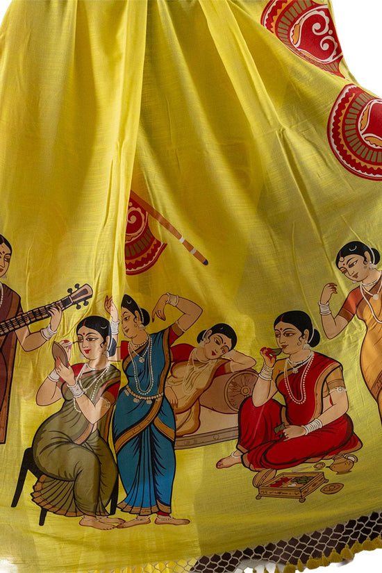 Yellow heritage edition saree featuring detailed Kalighat Patachitra artwork of women in daily life, crafted on soft khadi cotton.