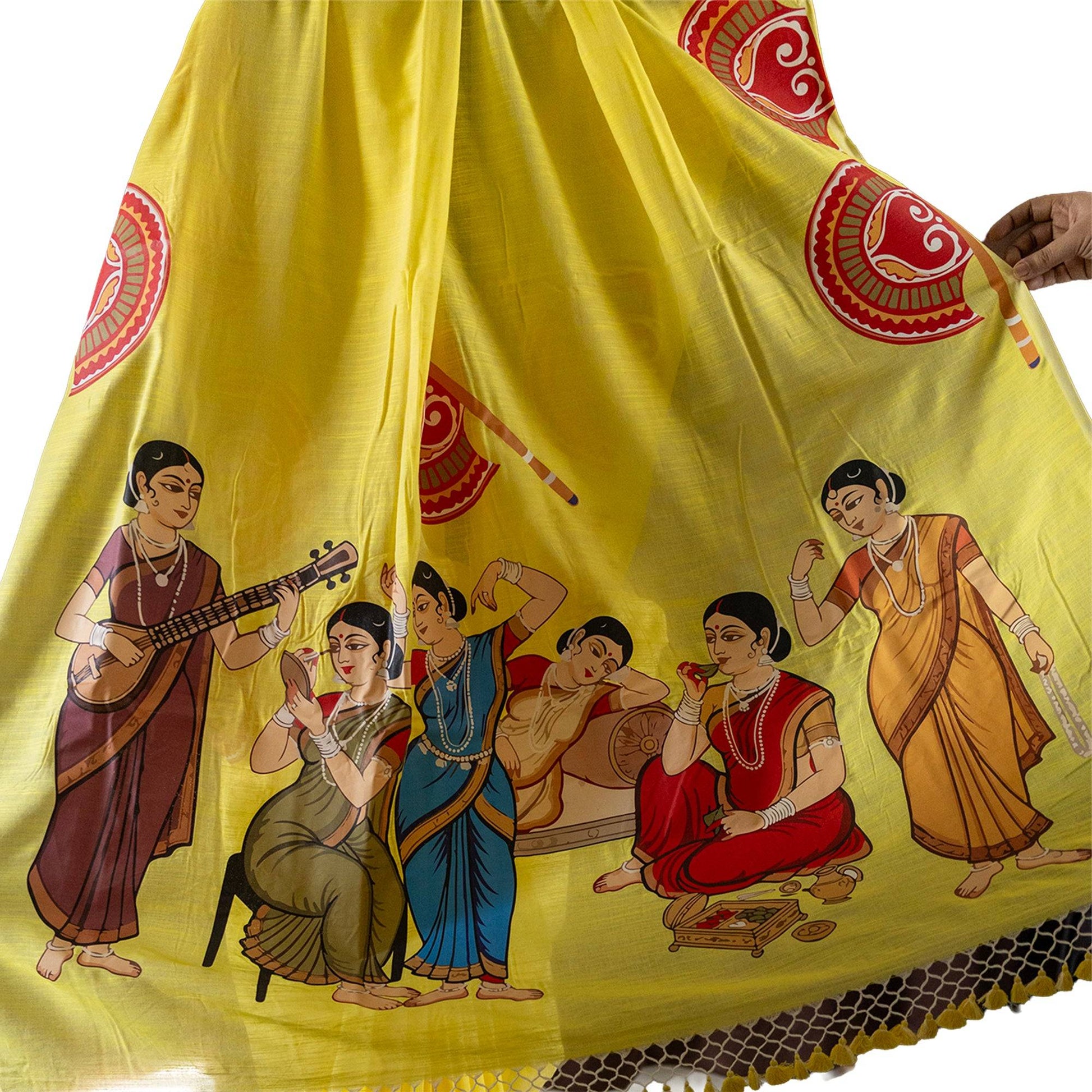 Yellow heritage edition saree featuring detailed Kalighat Patachitra artwork of women in daily life, crafted on soft khadi cotton.