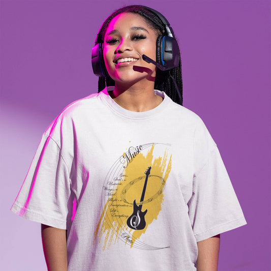 Model wearing Music My Love oversized unisex t-shirt with guitar graphic, perfect for music lovers, styled with headphones.