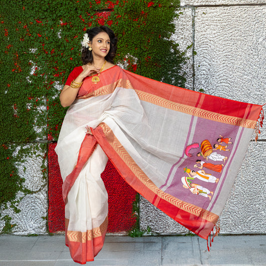 Durga Puja Cotton Saree with vibrant Nabapatrika Snan graphic print, showcasing heritage rituals on soft white cotton with red borders.