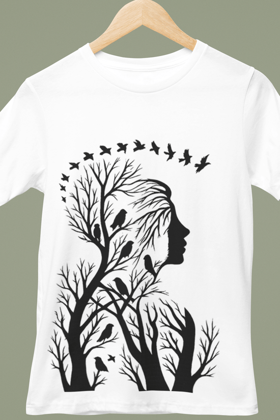 Artistic Woman Silhouette T-Shirt with black tree branches and birds forming a serene nature graphic on white unisex fit cotton tee.